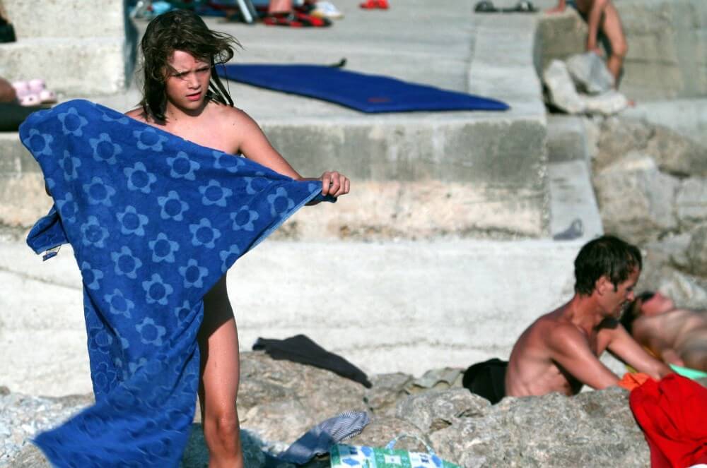 Nudist Rocky Family Angle - Naturists value harmony with nature and a simple way of life