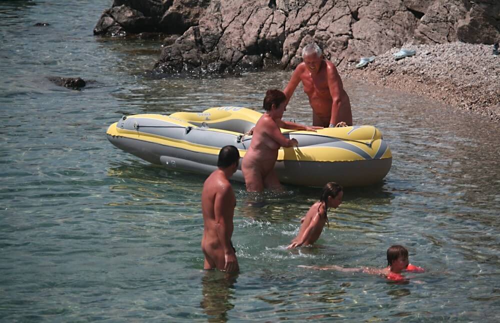 Lone Nudist in Yellow Boat photos - What exactly is nudism?