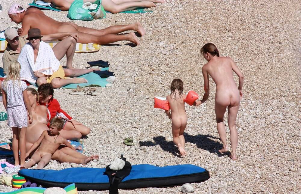 Orange Floaty Safety First Naturist pics - Nudists relax beautifully—a sight to behold