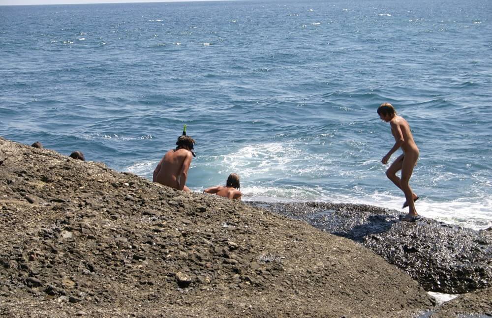 Leaning Against Hit Rocks pics - People who participate in nude recreation seek psychological comfort